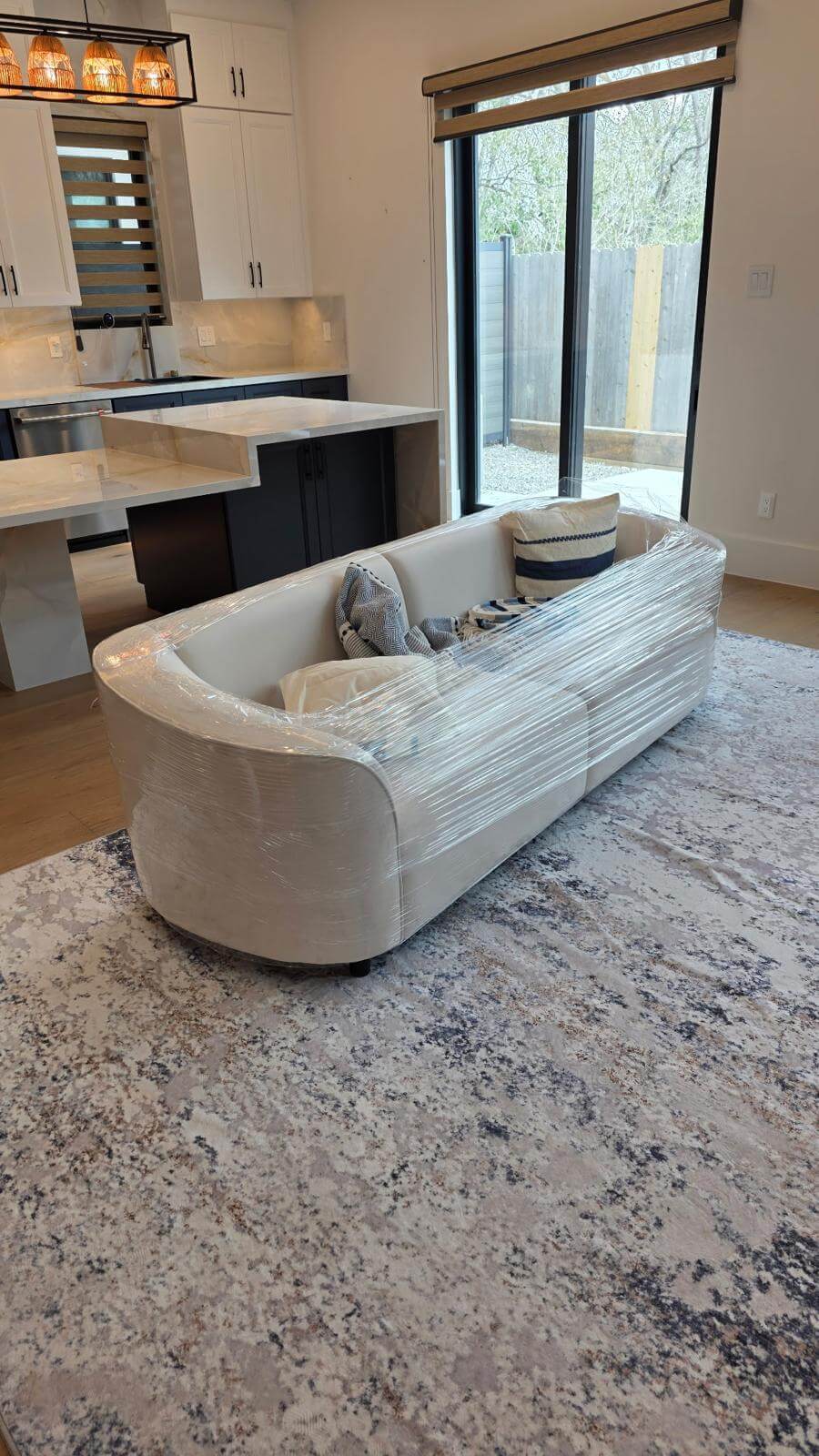 Professional movers handling furniture and moving boxes in Houston